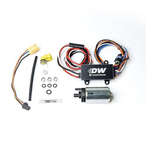 DeatschWerks DW440 brushless fuel pump kit with C102 controller, wiring harness, connectors and install hardware laid out flat