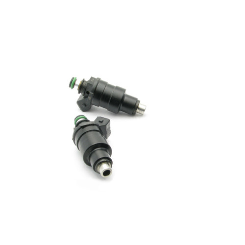 DeatschWerks 550cc top feed fuel injectors, pair shown at angle with green O-rings and connector tips visible
