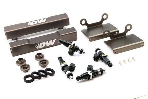 DeatschWerks top feed fuel rail conversion kit with 1500cc injectors, brackets and mounting hardware laid out