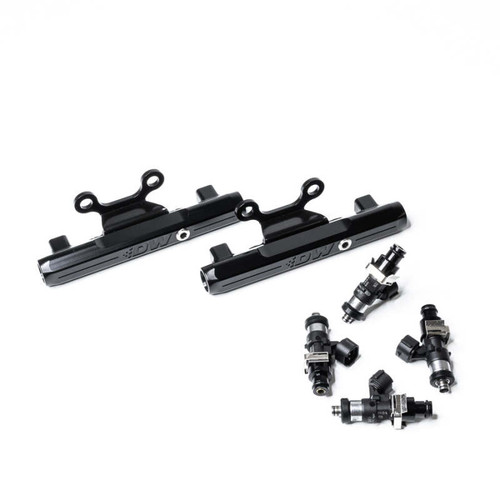 DeatschWerks top feed fuel rail kit with 2200cc injectors, black rails and six injectors shown at an angle.