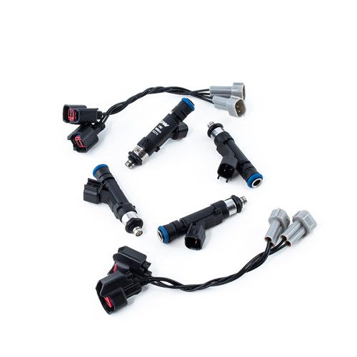 DeatschWerks 800cc fuel injector set with wiring adapters for 13-14 Hyundai Genesis Coupe 2.0T, top view.