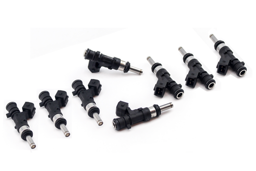 Set of eight DeatschWerks 850cc top feed fuel injectors for Hellcat, arranged in a diagonal row on white.