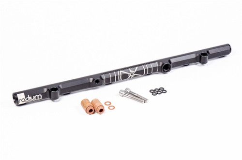 Radium Engineering RB26DETT fuel rail, black billet, with copper spacers, banjo bolt, and O-rings laid out