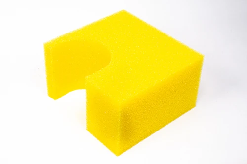 Radium Engineering fuel cell foam block, yellow, one piece with corner notch, angled view on white background