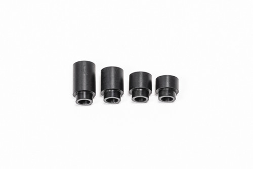 Radium Engineering 15mm insulating spacers, four black cylindrical bushings of varying heights, side view.