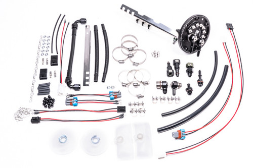 Radium fuel hanger kit for Toyota Chaser/Mark II/Cresta, showing fittings, hoses, wiring, clamps and hardware laid out.