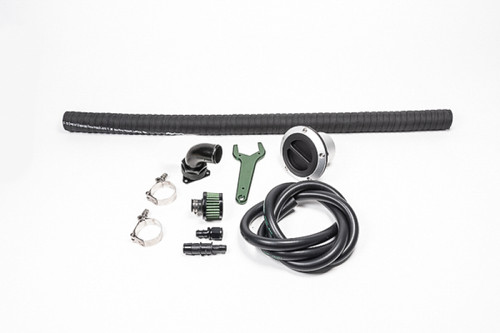 Radium Engineering FCST-X Refueling Kit with fill cap, hoses, clamps, fittings, and wrench laid flat