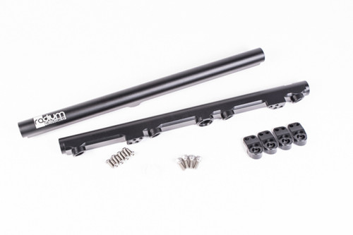 Radium Engineering GM LS fuel rails set with black anodized finish, injector clips, and mounting screws laid out
