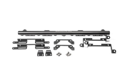 Radium Engineering Ford Barra fuel rail with mounting brackets, spacers and hardware laid out, top down view
