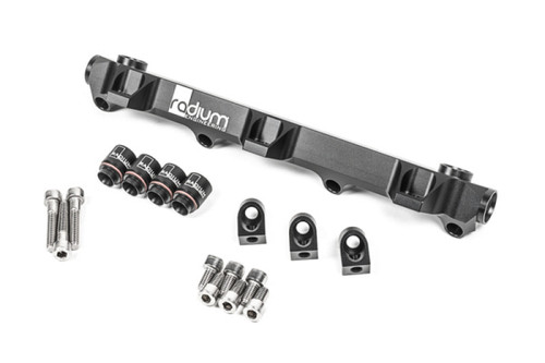 Radium Engineering fuel rail for Toyota MR2 3S-GTE, angled view with mounting bolts, hex fittings, and brackets