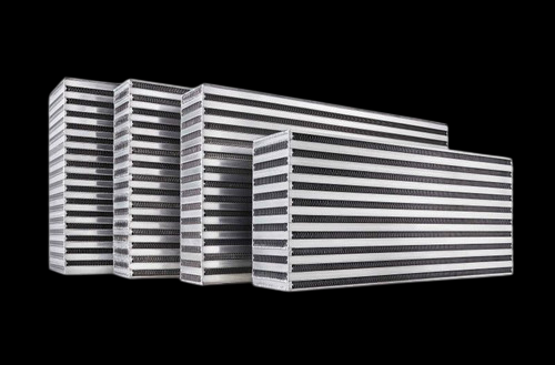 Garrett air to air intercooler core, four sizes shown side by side, angled front view showing fin stacks