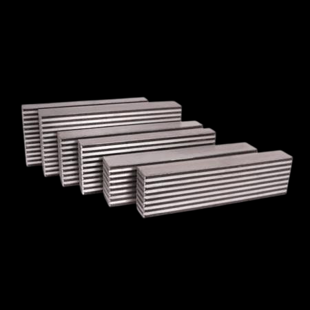 Garrett air to air intercooler core, six stacked bar and plate cores shown at an angle, ribbed fin detail visible