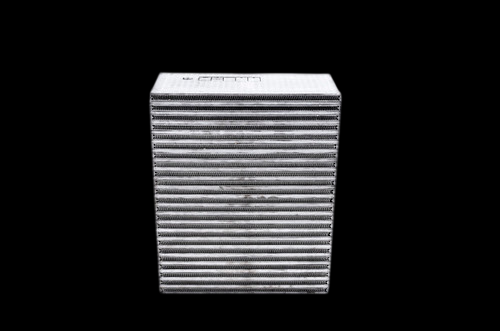 Garrett air to air intercooler core, front angled view showing stacked cooling fins, black background