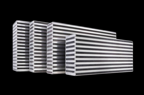 Garrett Subaru WRX intercooler core, four core sizes shown side by side, front angled view on black background