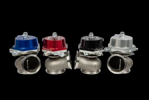 Garrett GVW-60 60mm wastegate, red cap version shown front row among blue, black and silver units