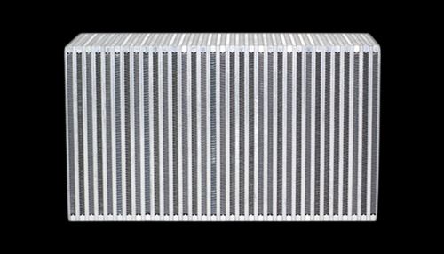 Vibrant vertical flow intercooler core, front angled view showing dense aluminum cooling fins, bare metal finish