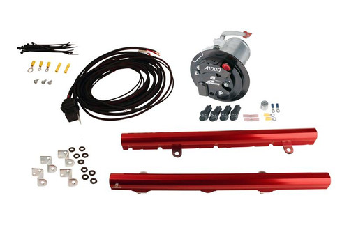 Aeromotive A1000 fuel system kit, black pump, red LS3 fuel rails, wiring harness, fittings and zip ties laid out.