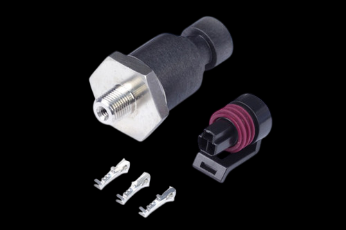 Haltech 2000 PSI pressure sensor with hex fitting, plug connector and three metal terminal pins on black background