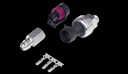 Haltech 500 PSI TI pressure sensor kit with connector, terminals, and fitting adapter on black background