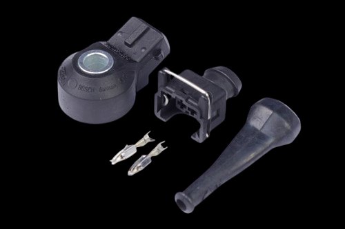 Haltech Bosch knock sensor kit with connector plug, terminal pins, and rubber boot on black background
