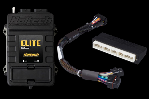 Haltech Elite 2500 ECU with adaptor harness and connector plug, angled view showing wiring and case