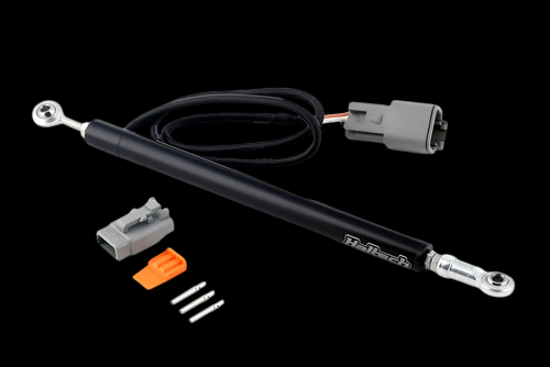Haltech linear position sensor with wired connector, rod ends, plus loose connector and pins on black background