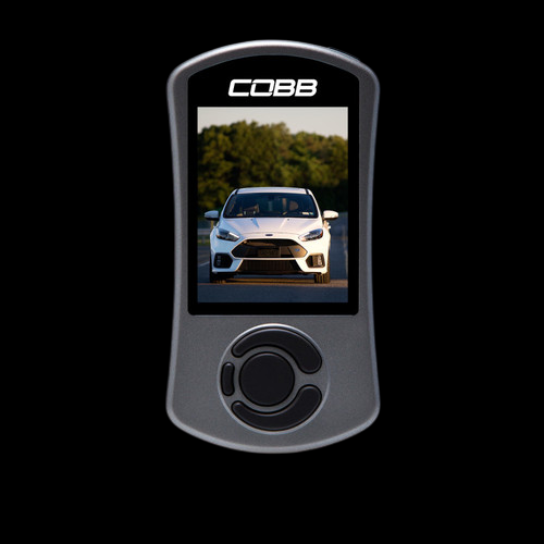 Cobb AccessPORT V3 handheld tuner with screen showing white Ford Focus RS, front control dial visible