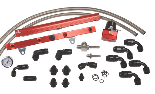 Aeromotive C5 Corvette fuel rail kit with red rails, regulator, hoses and black fittings laid out