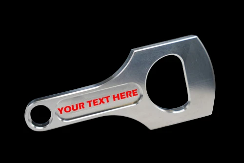 Connecting rod bottle opener in polished aluminum, angled view showing customizable YOUR TEXT HERE engraving