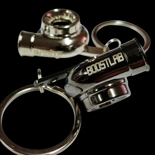 Boost Lab Turbo Key Chain, chrome turbo shape with split ring, close angled view showing BOOSTLAB text