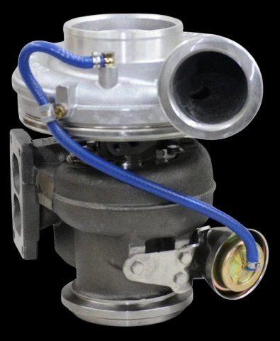 BorgWarner K31 turbocharger for CAT C12 12.7L, side angle showing compressor housing, wastegate actuator with blue hose, and exhaust inlet flange