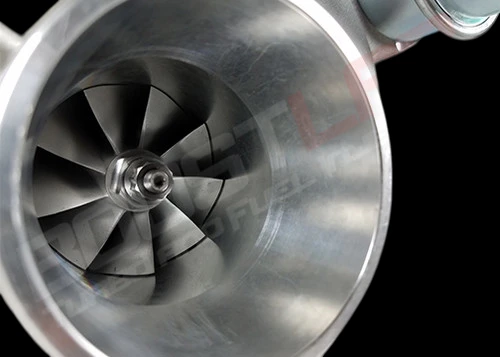 Close-up front view of GTP38 turbocharger compressor wheel and housing, showing blade detail and shaft.