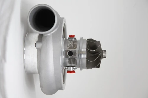 Xona Rotor 82-68 X3C turbo, side view showing compressor wheel, housing and inlet, red fittings visible