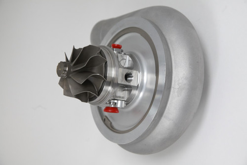 Xona Rotor 78-65 X3C turbo cartridge, front angle showing compressor wheel and housing with red plugs