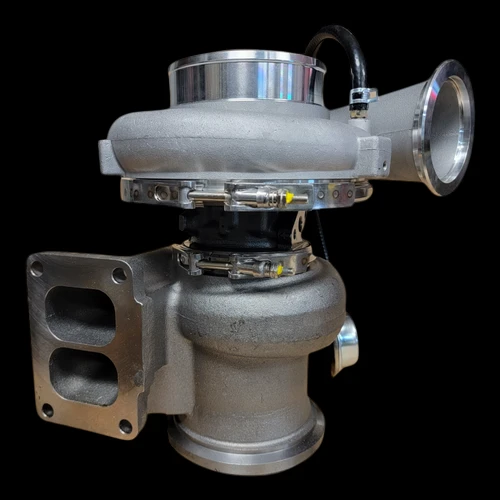 K31 turbocharger for Detroit Diesel Series 60, side angle showing T4 flange, compressor housing and oil fittings