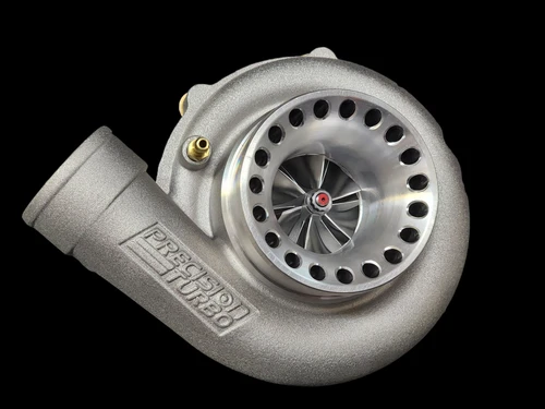 Precision PT5558 CEA turbo, side angle showing compressor wheel, housing, and curved inlet elbow