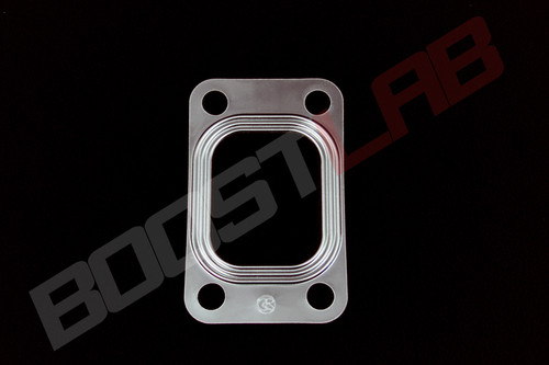 T3 turbo inlet gasket, metal multi layer design, four bolt holes, black background studio shot