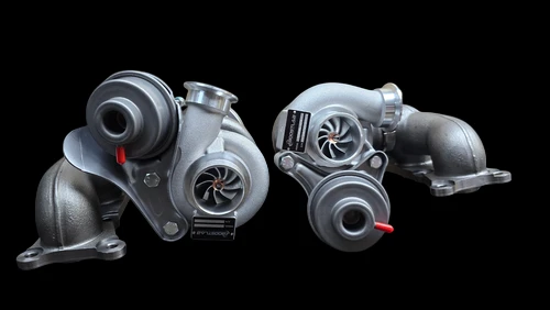 Pair of N54 BMW TD04L-17T upgrade turbos, front angle showing compressor housings and inlet pipes