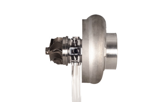 Xona XR 8269S X3C turbo, side view showing compressor wheel, turbine housing, and oil drain fitting.