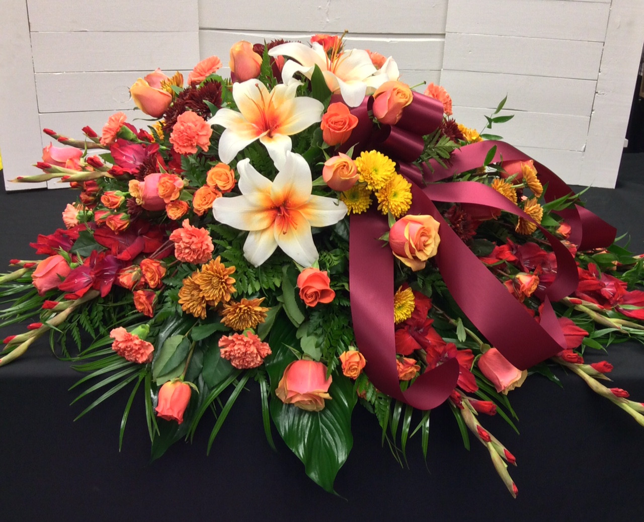 Fiery Autumn Half Couch Casket Spray - Centerville Florists