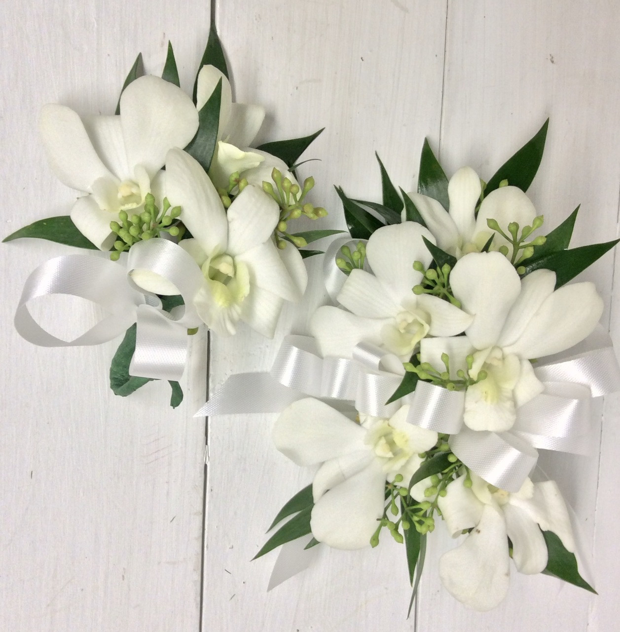 White Orchids And White Satin Wrist Corsage And Boutonniere Combo Centerville Florists