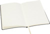 A black Tango A5 notebook with lined pages and a ribbon bookmark, open to reveal the blank interior.