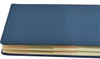A blue A5 notebook with a textured cover and multiple internal sections. Features a logo on the cover.