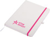 A white A5 notepad with a pink elastic band and a logo on the cover.