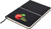 A black A5 notepad with an elastic closure and a logo featuring an apple and text.
