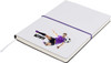 A purple-bound notepad featuring an illustration of a soccer player and a logo on the cover.