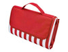 A red and white striped picnic rug, folded, featuring a handle for easy carrying and a logo.