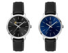 A pair of ladies' dress watches featuring a black and a navy blue dial, both with leather straps and silver-tone cases.