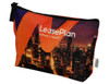 A vibrant orange and black toiletry pouch featuring a city skyline design and a branded logo.