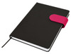 A black A5 notebook with a pink elastic closure, featuring a ribbon bookmark and a textured cover.